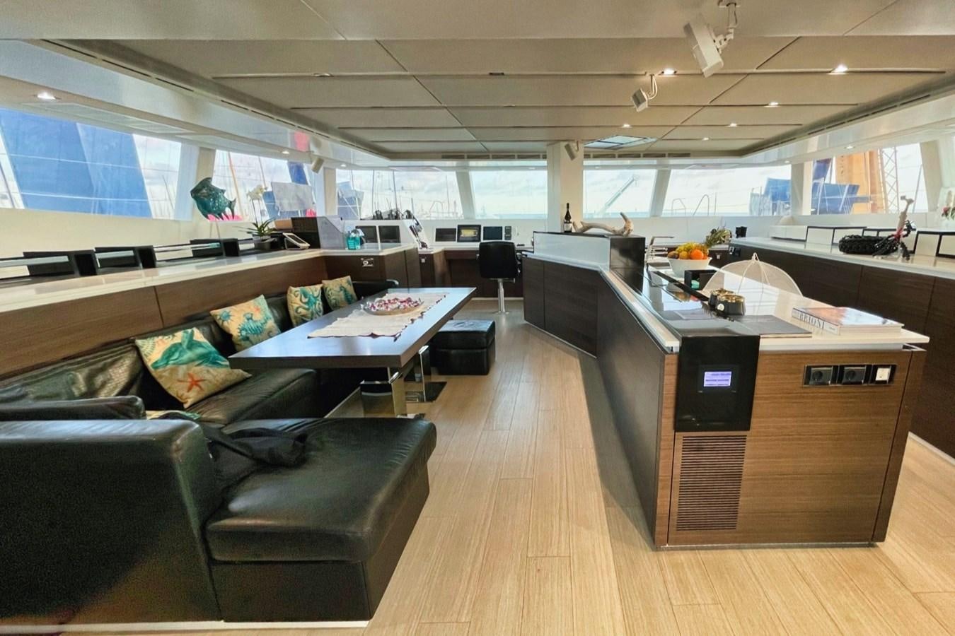 a room with a couch and a table aboard ALKIMIA Yacht for Sale