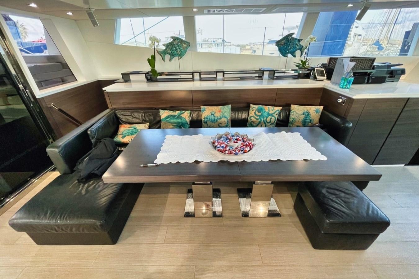 a room with a couch and a table aboard ALKIMIA Yacht for Sale