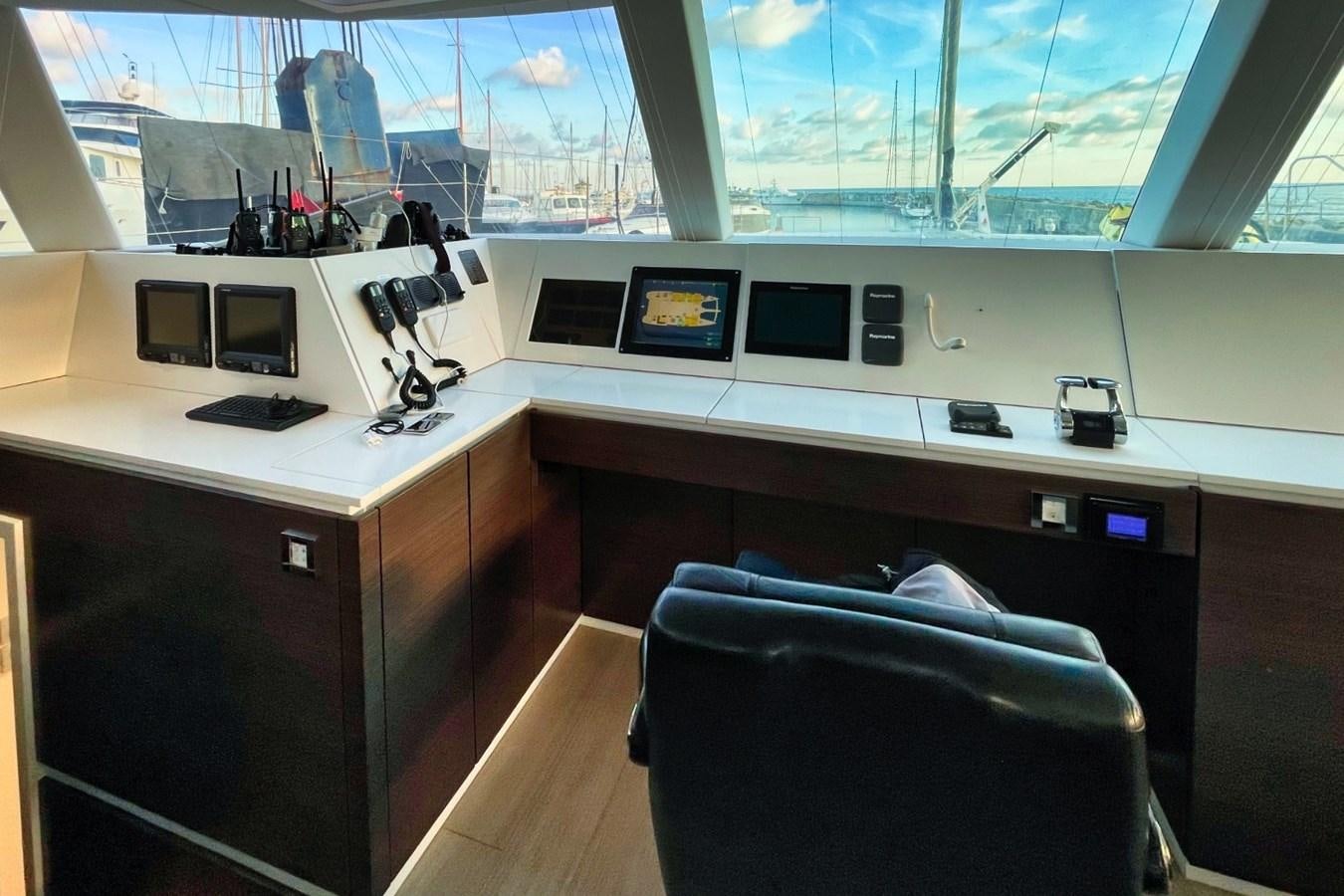 a room with computers and monitors aboard ALKIMIA Yacht for Sale