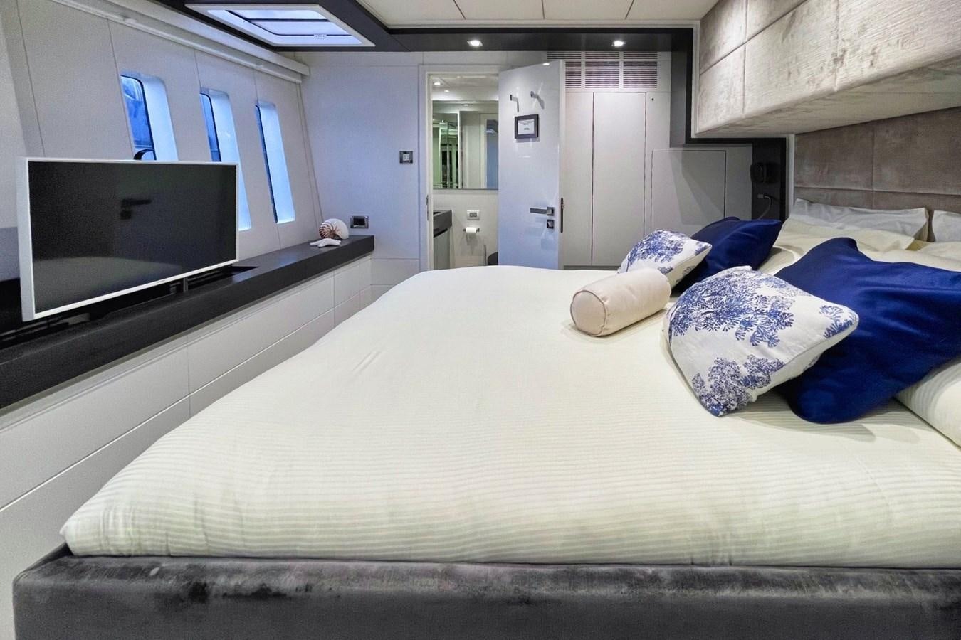 a bed with a television on top aboard ALKIMIA Yacht for Sale