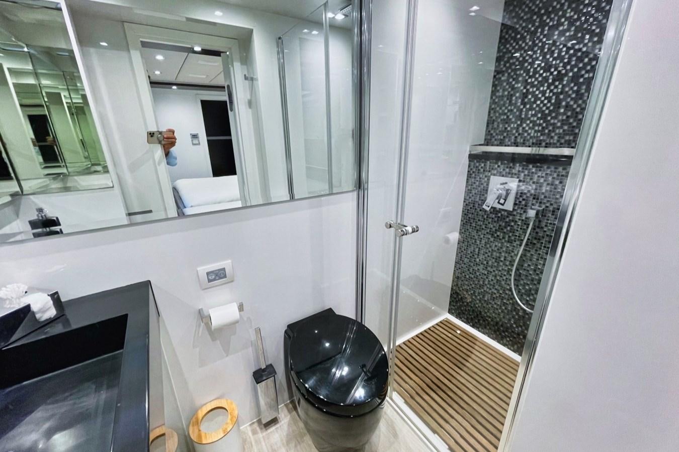 a bathroom with a black bucket aboard ALKIMIA Yacht for Sale