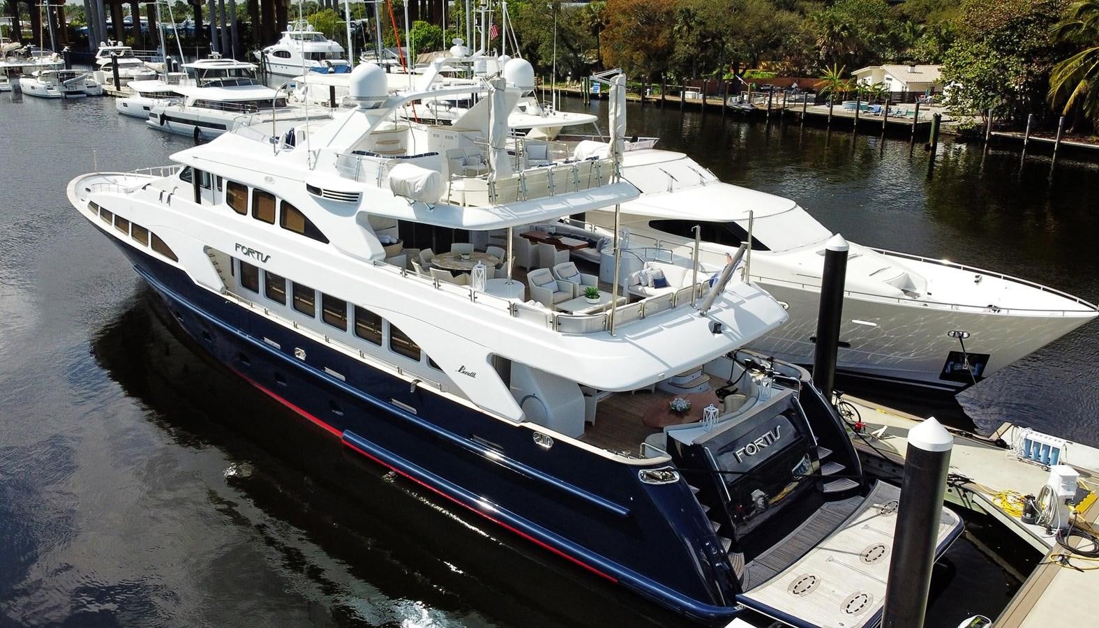 a boat docked at a pier aboard FORTIS Yacht for Sale