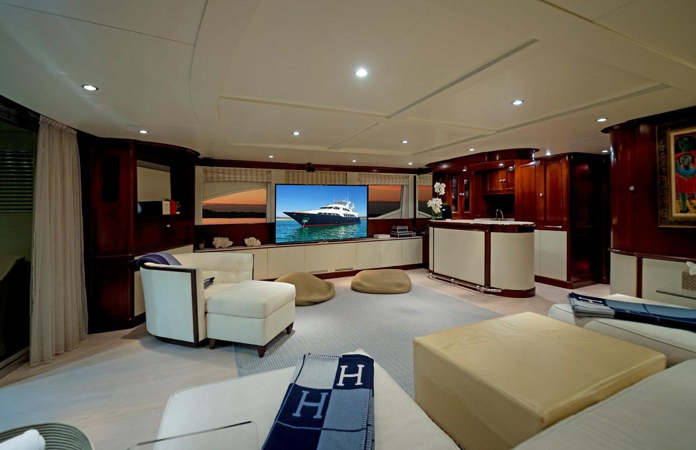 a room with a large screen aboard FORTIS Yacht for Sale