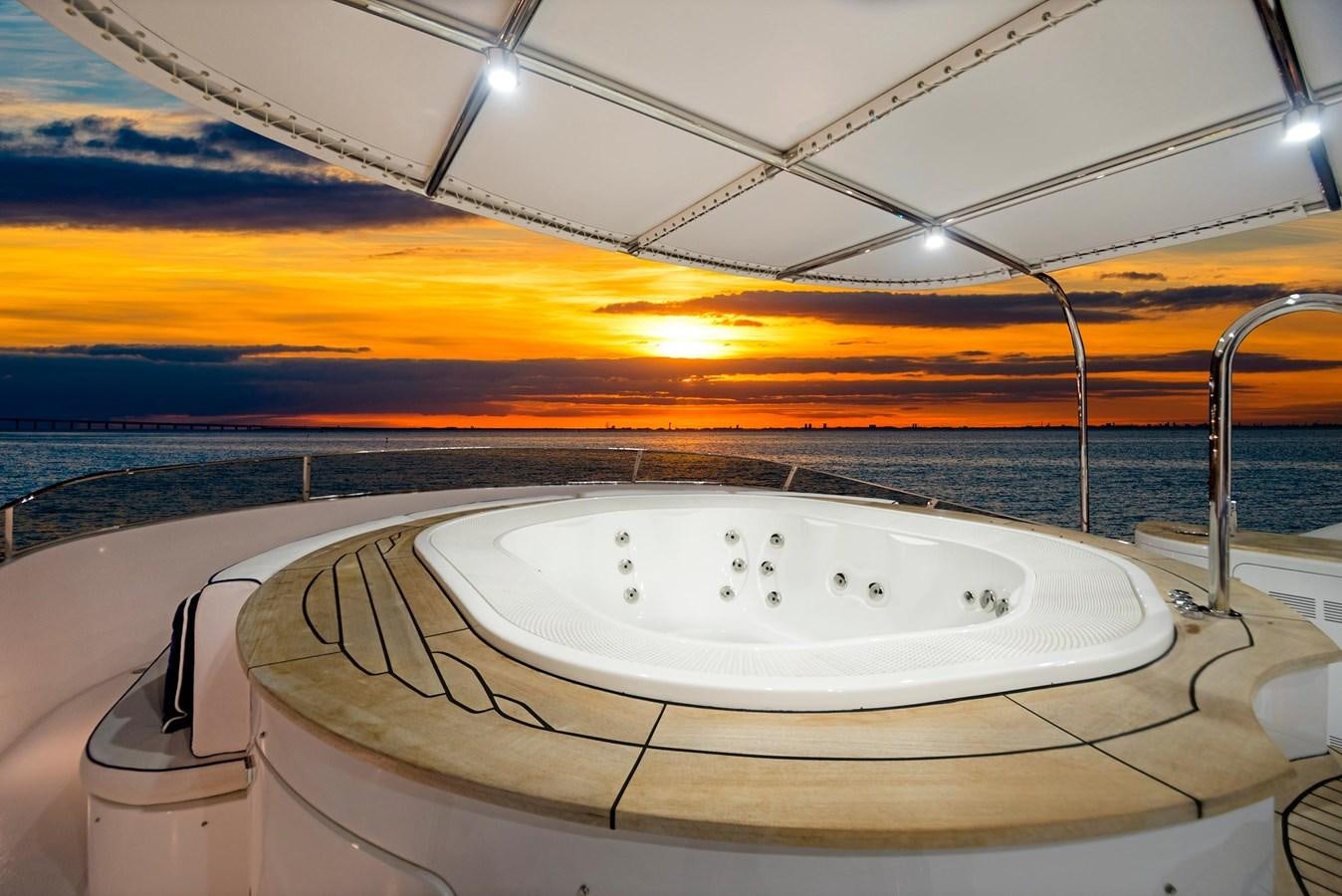 a large white sink in a room with a sunset in the background aboard FORTIS Yacht for Sale