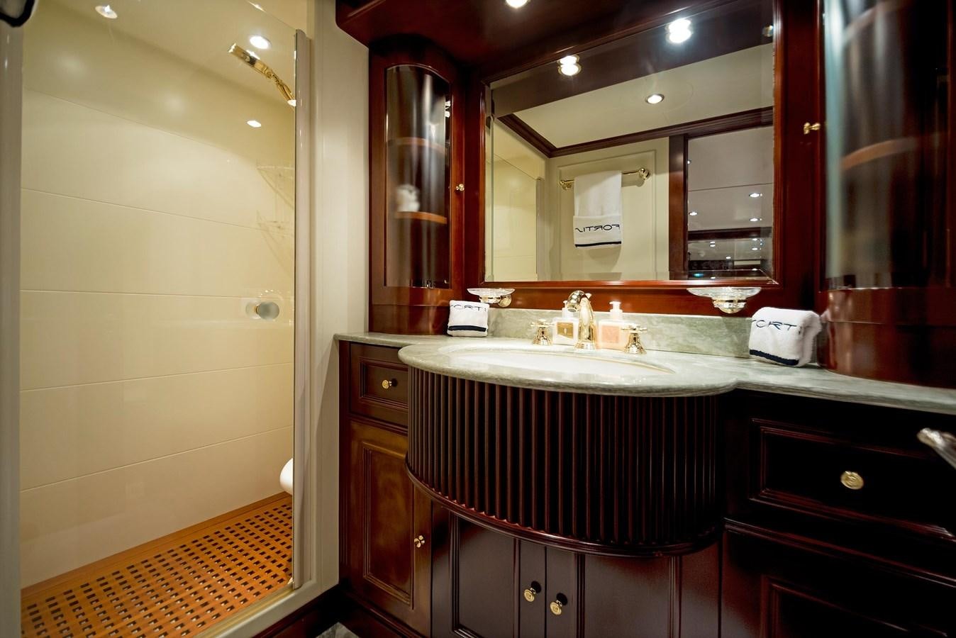 a bathroom with a sink and a mirror aboard FORTIS Yacht for Sale
