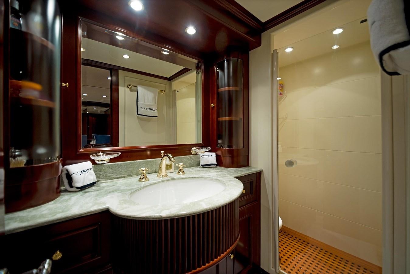 a bathroom with a large mirror aboard FORTIS Yacht for Sale