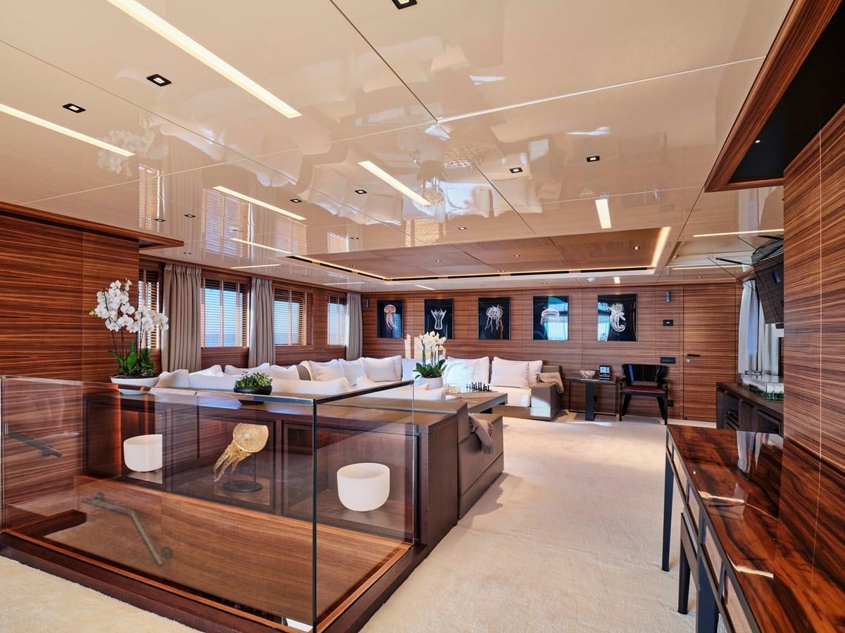 a large room with a large table and chairs aboard MAGNA GRECIA Yacht for Sale