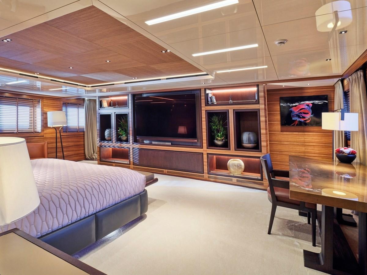 a bedroom with a bed and a tv aboard MAGNA GRECIA Yacht for Sale