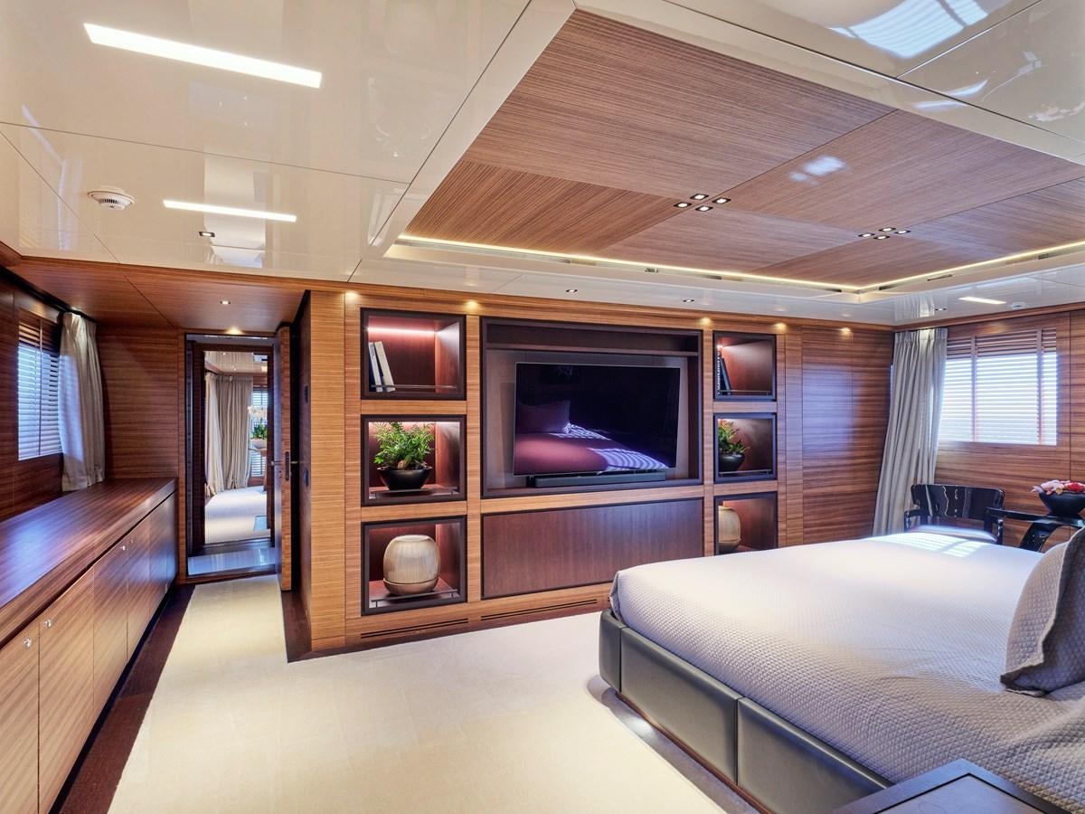 a living room with a large television aboard MAGNA GRECIA Yacht for Sale