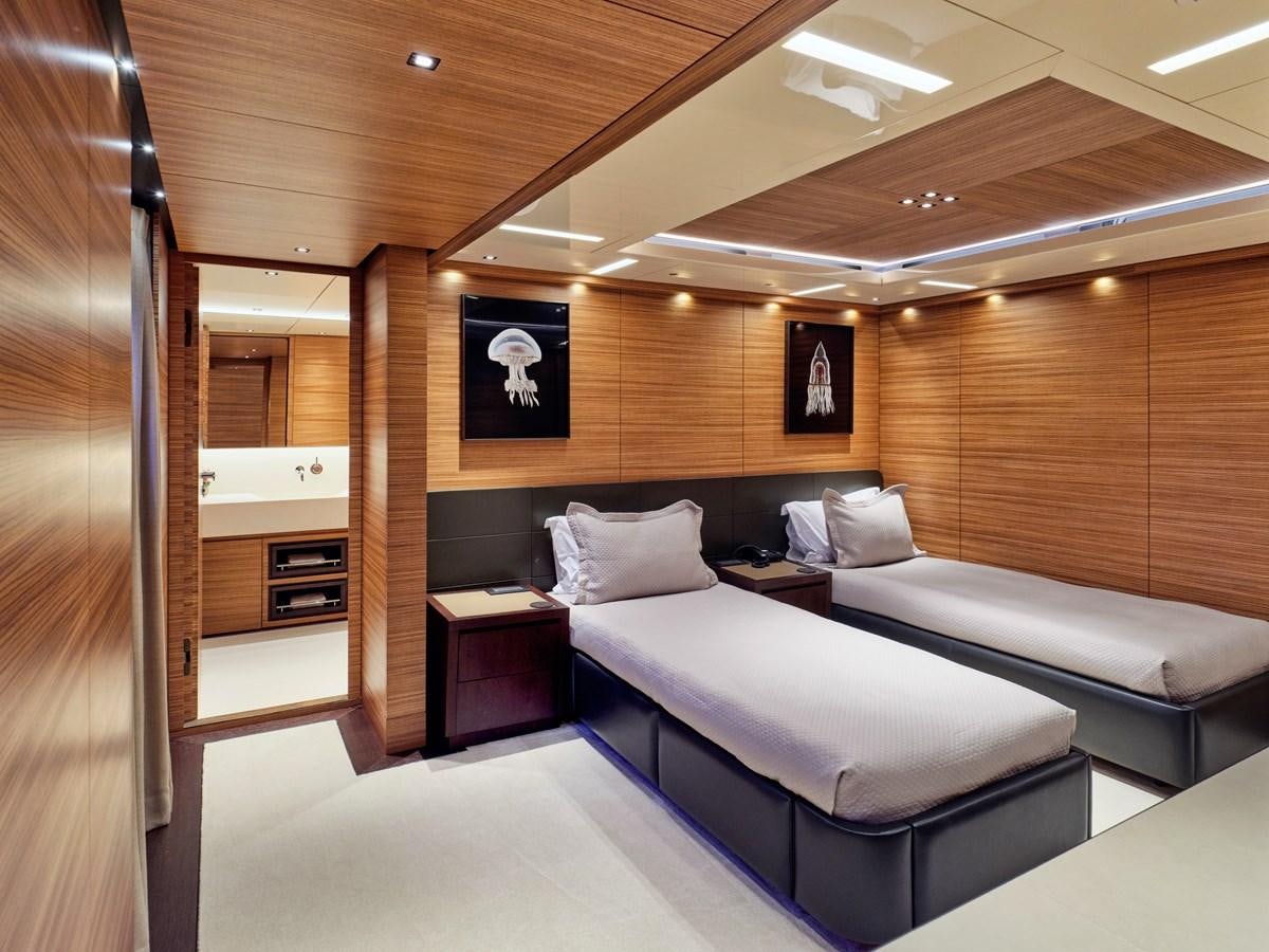 a room with a bed and a desk aboard MAGNA GRECIA Yacht for Sale