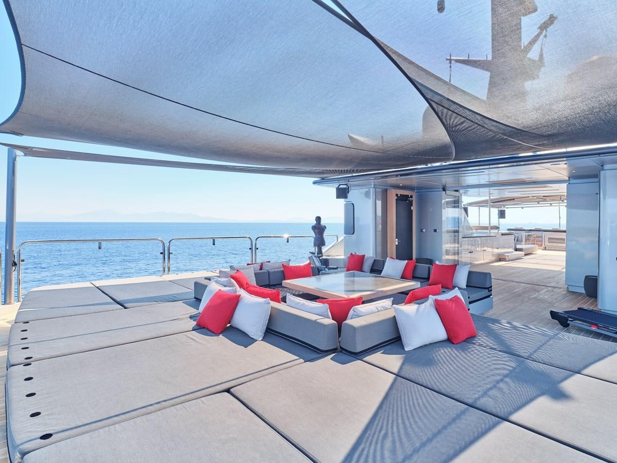 a room with a large bed and a large body of water aboard MAGNA GRECIA Yacht for Sale