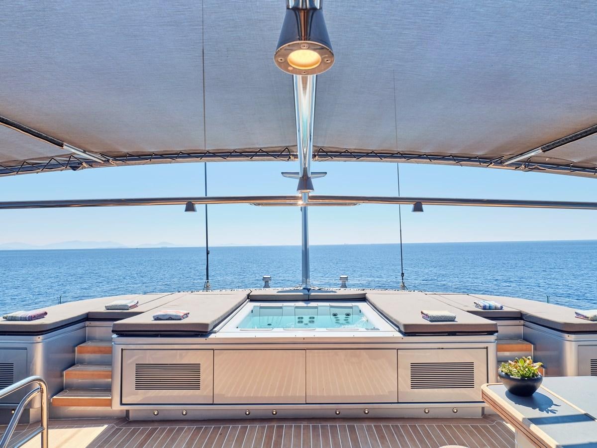 a deck with a large deck overlooking the ocean aboard MAGNA GRECIA Yacht for Sale
