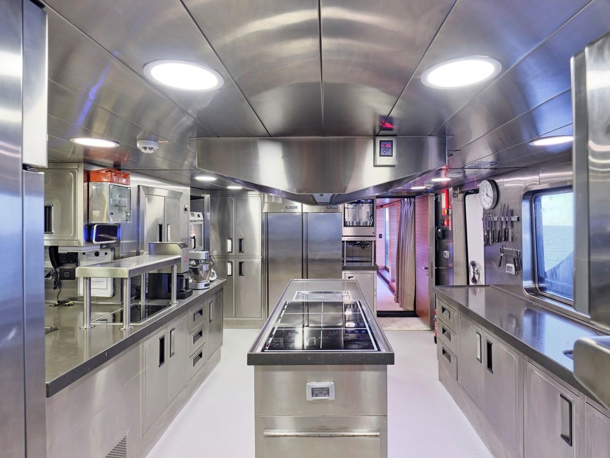a kitchen with a large island aboard MAGNA GRECIA Yacht for Sale