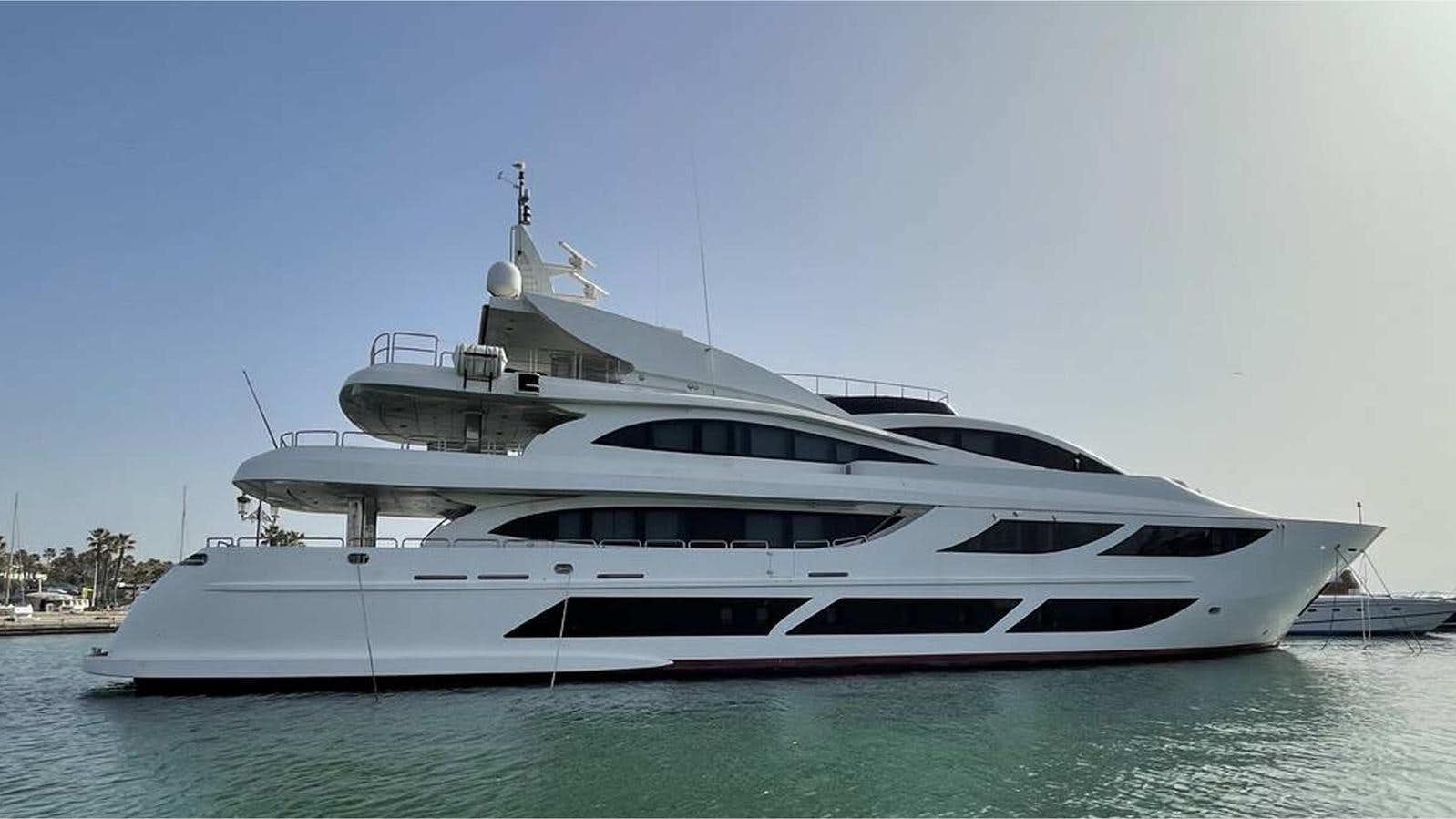 a large white yacht in the water aboard MOZA Yacht for Sale