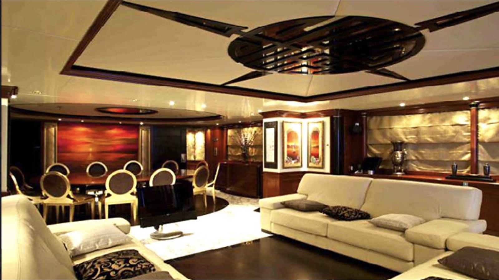 a living room with a couch and a table aboard MOZA Yacht for Sale