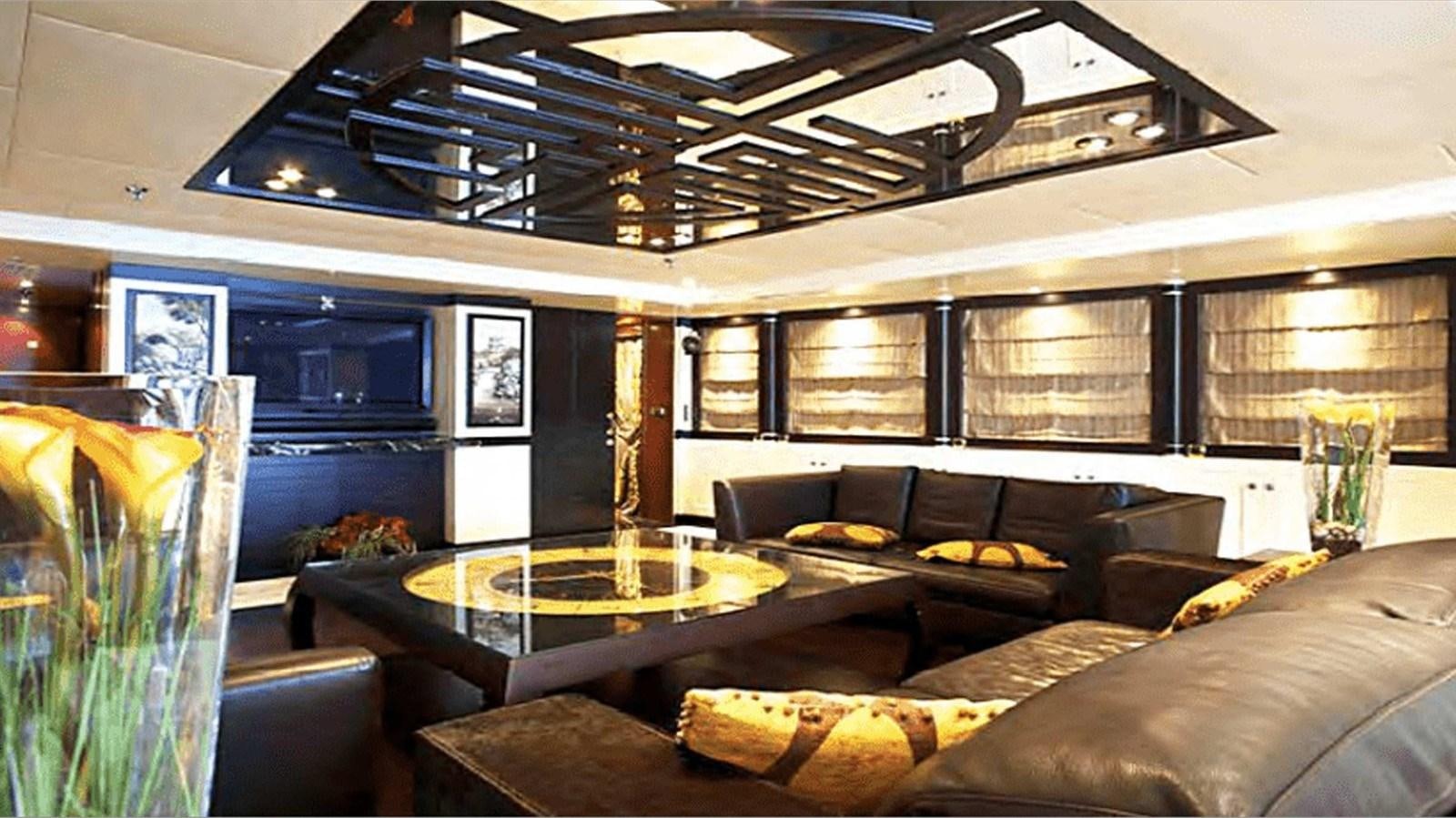 a room with a couch and a table aboard MOZA Yacht for Sale