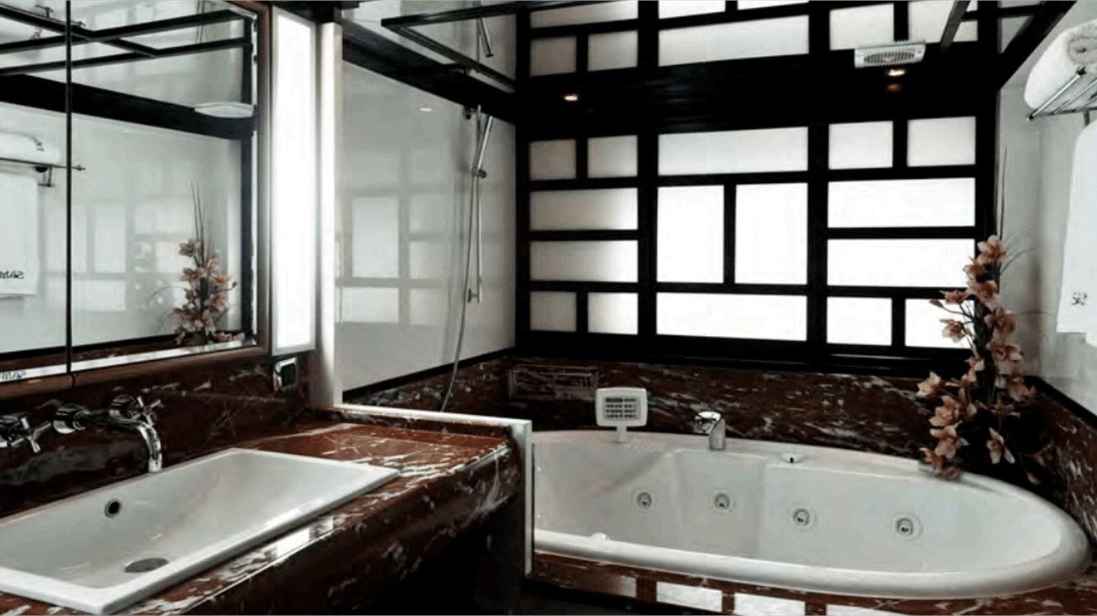 a large bathroom with a large tub aboard MOZA Yacht for Sale