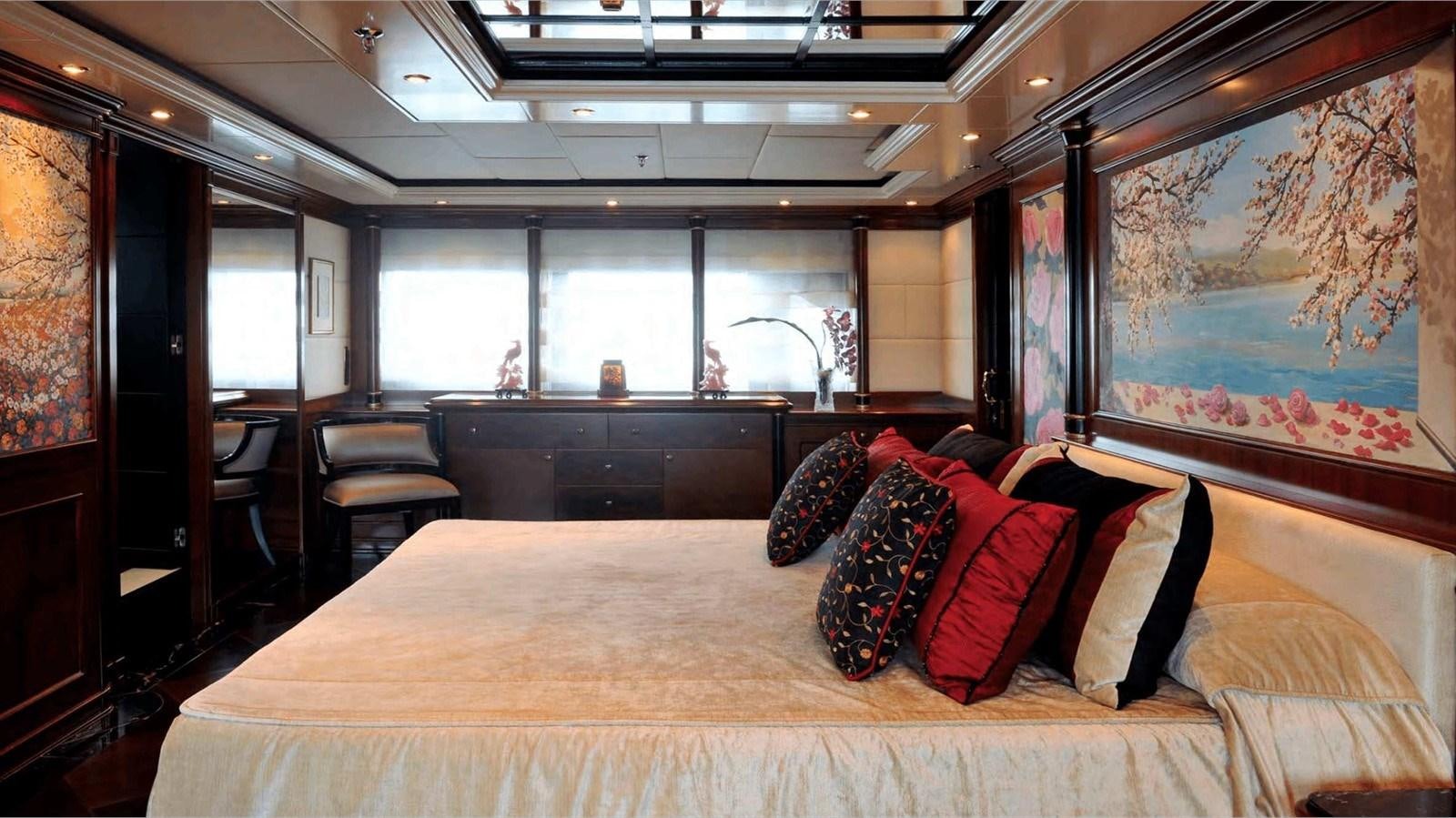 a large bed in a room aboard MOZA Yacht for Sale