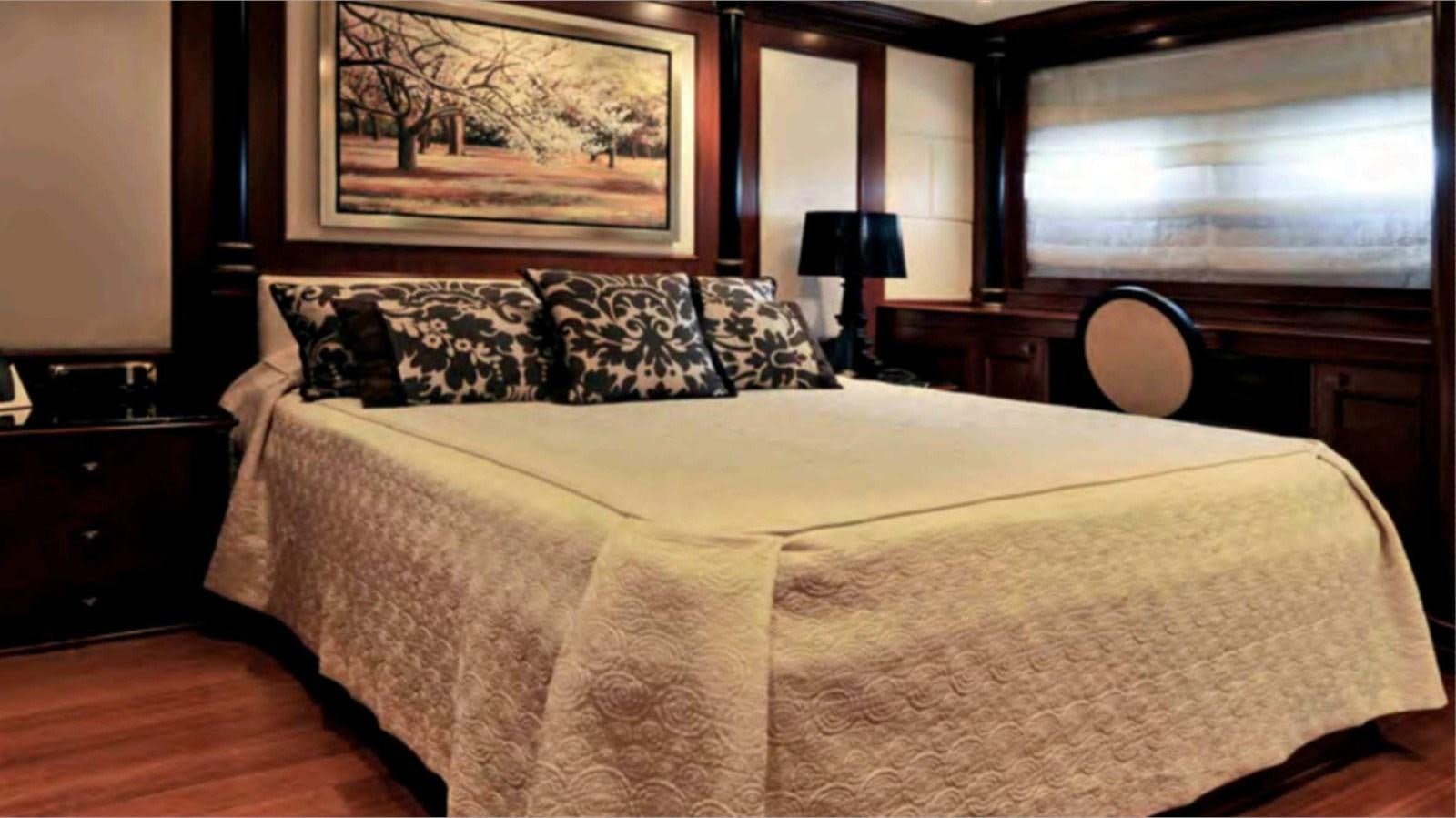 a bed with pillows aboard MOZA Yacht for Sale