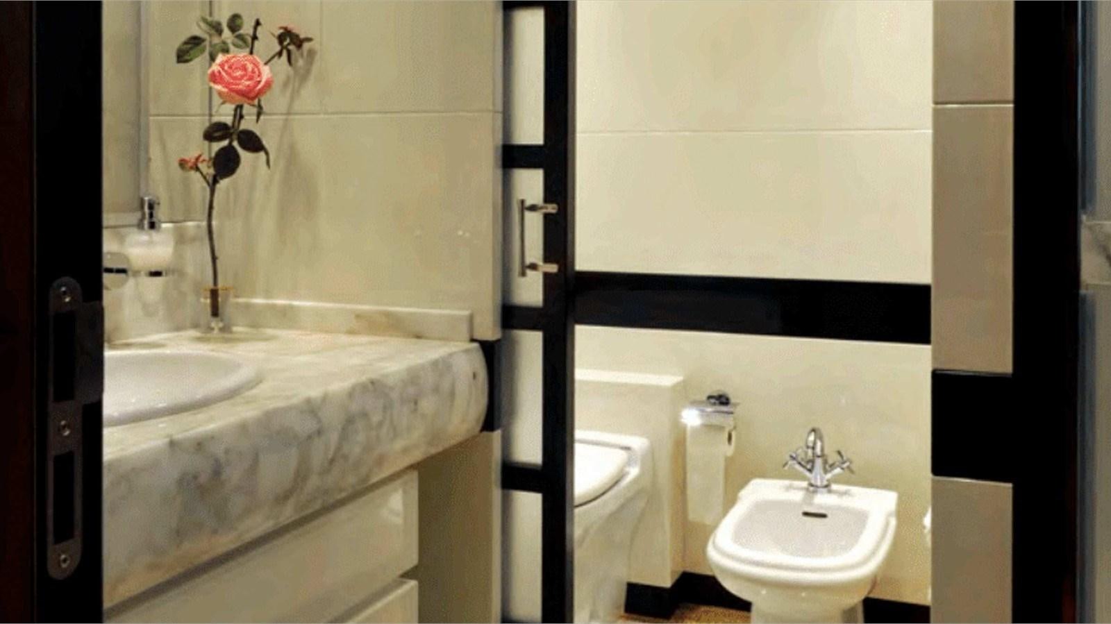 a bathroom with a sink and a bathtub aboard MOZA Yacht for Sale