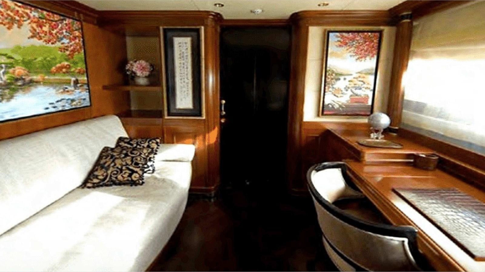a room with a bed and a chair aboard MOZA Yacht for Sale