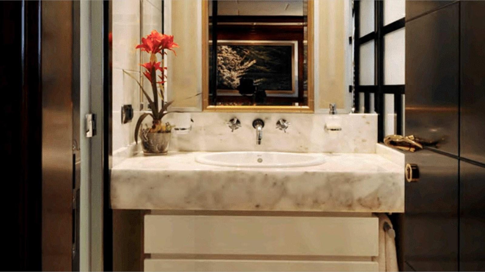 a bathroom with a sink and a mirror aboard MOZA Yacht for Sale