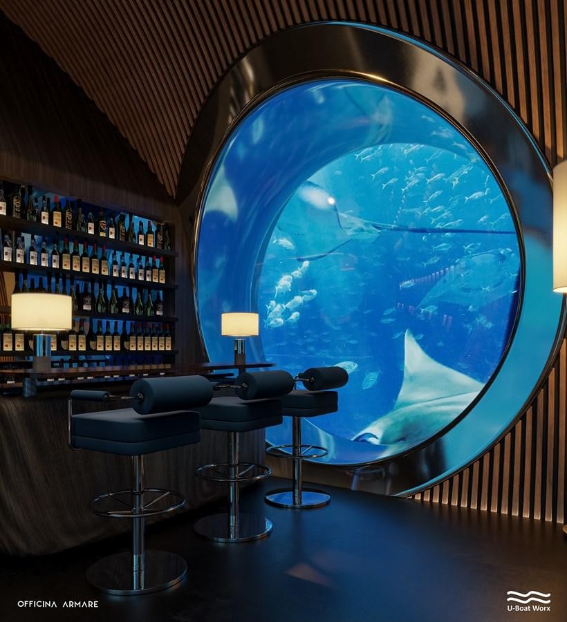 a room with a globe and a table and chairs aboard NAUTILUS Yacht for Sale