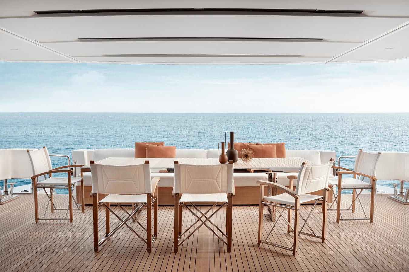 a table set up on a deck overlooking the ocean aboard COOL Yacht for Sale