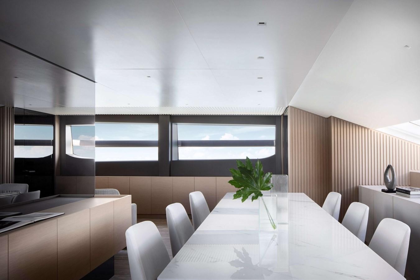 a room with tables and chairs aboard COOL Yacht for Sale