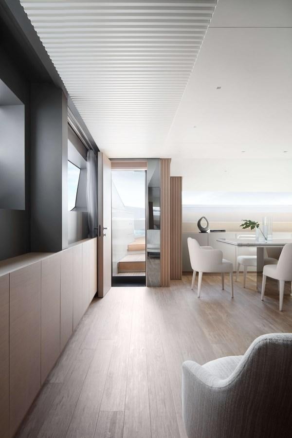 a room with a table and chairs aboard COOL Yacht for Sale