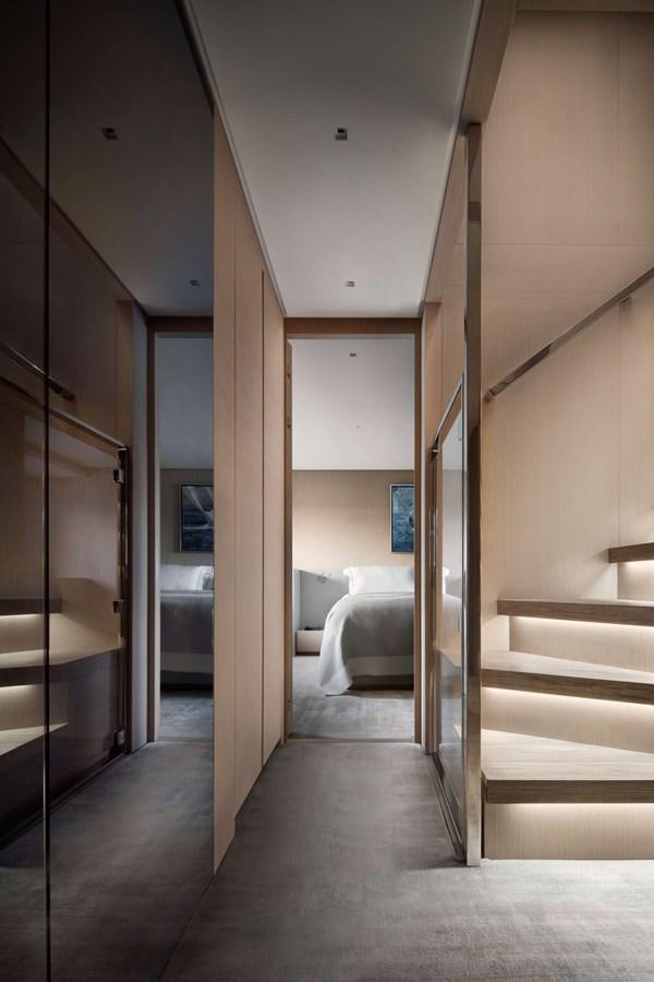 a hallway with a bed and a door aboard COOL Yacht for Sale