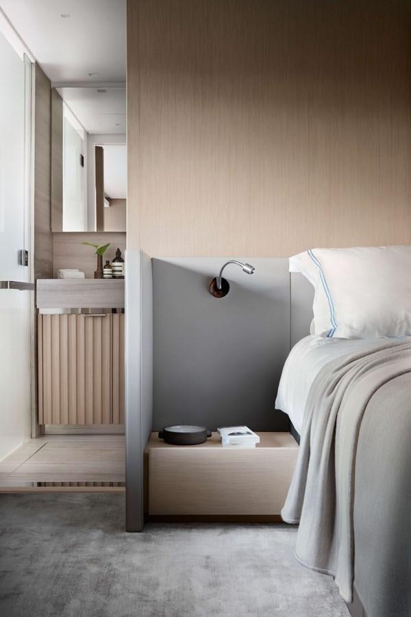 a room with a bed and a desk aboard COOL Yacht for Sale