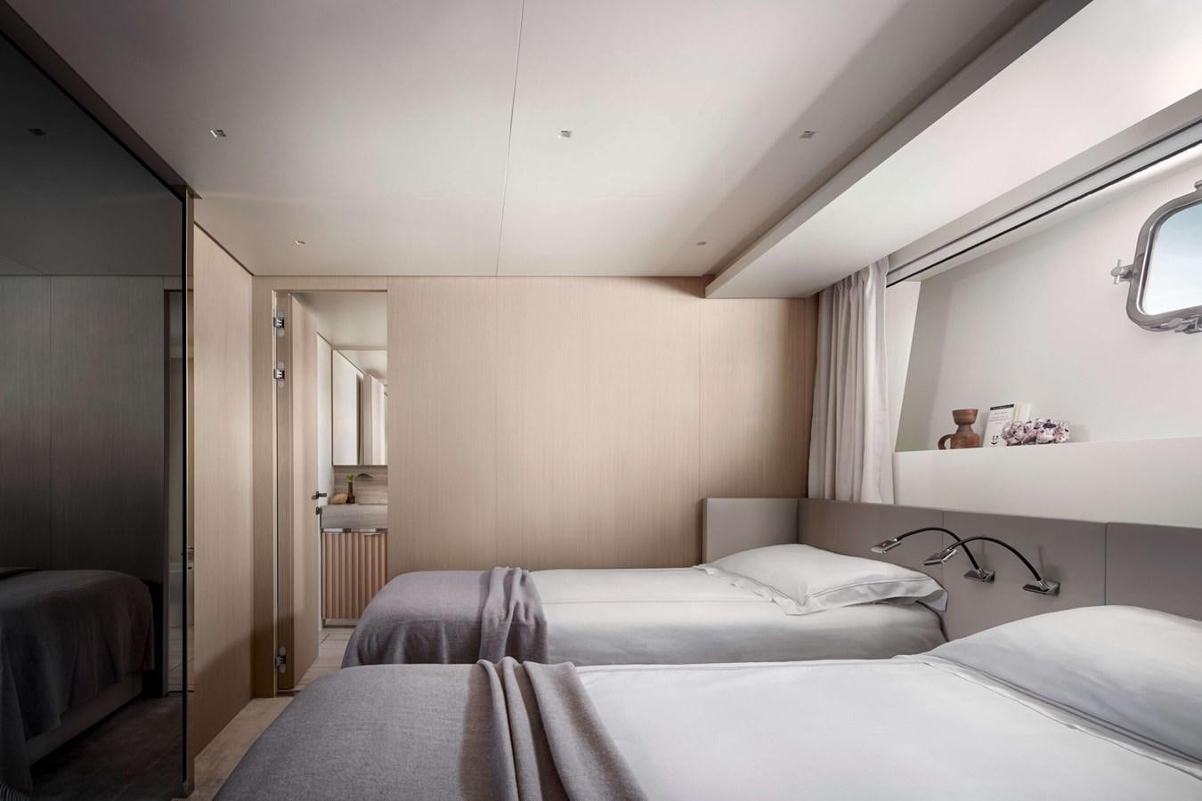 a bedroom with two beds aboard COOL Yacht for Sale