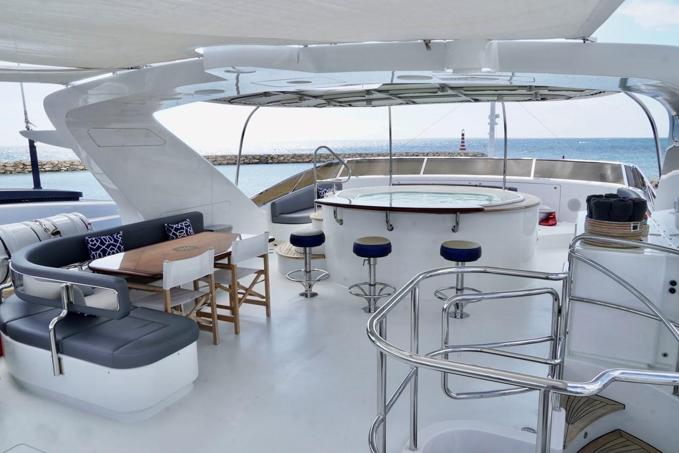 a white airplane with tables and chairs aboard PAPAITO Yacht for Sale