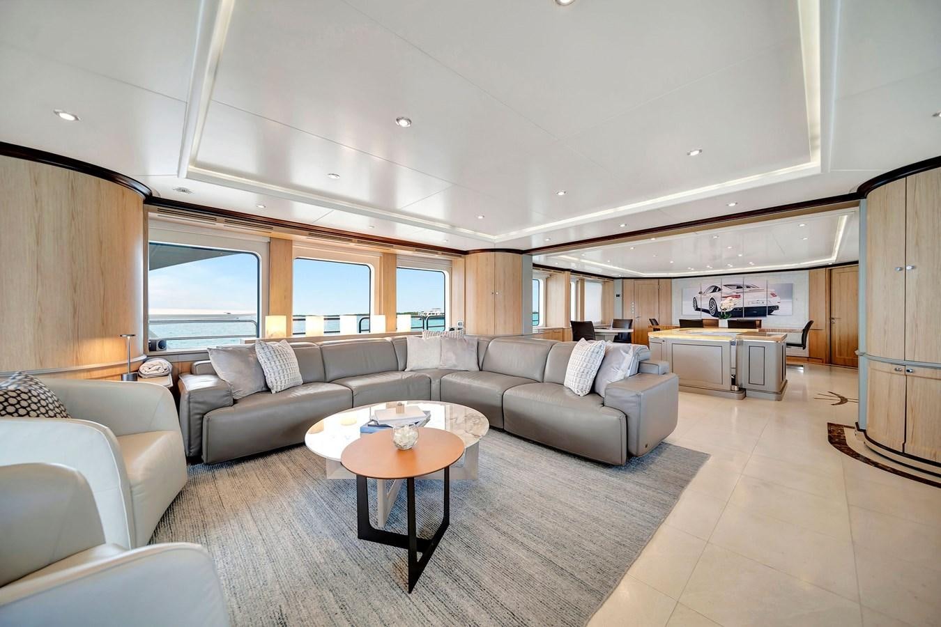 a living room with a couch and a coffee table aboard PAPAITO Yacht for Sale