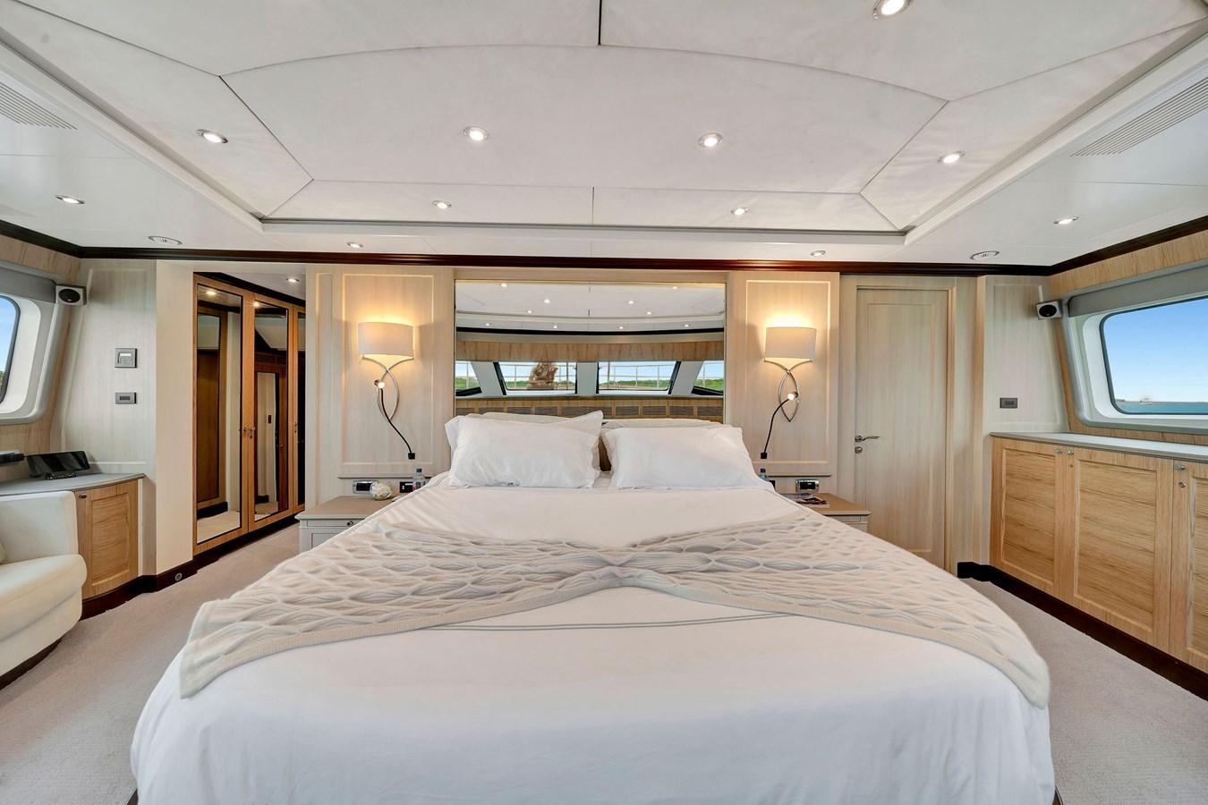 a large bed in a hotel room aboard PAPAITO Yacht for Sale
