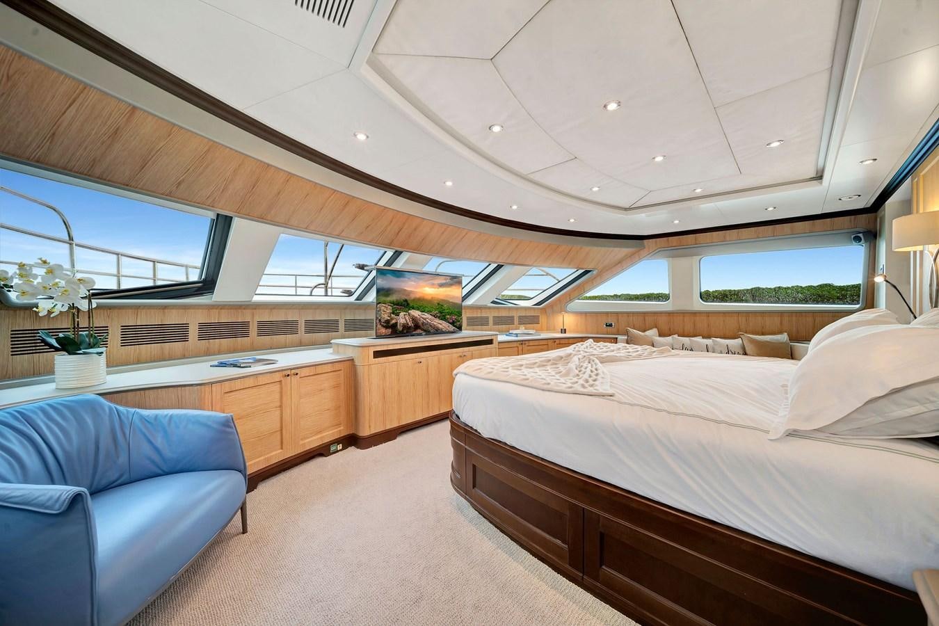 a room with a bed and a couch aboard PAPAITO Yacht for Sale