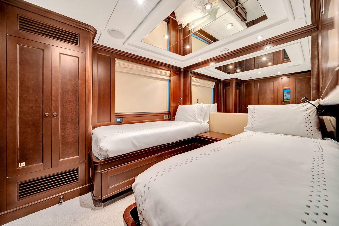 a room with a bed and a cupboard aboard PAPAITO Yacht for Sale