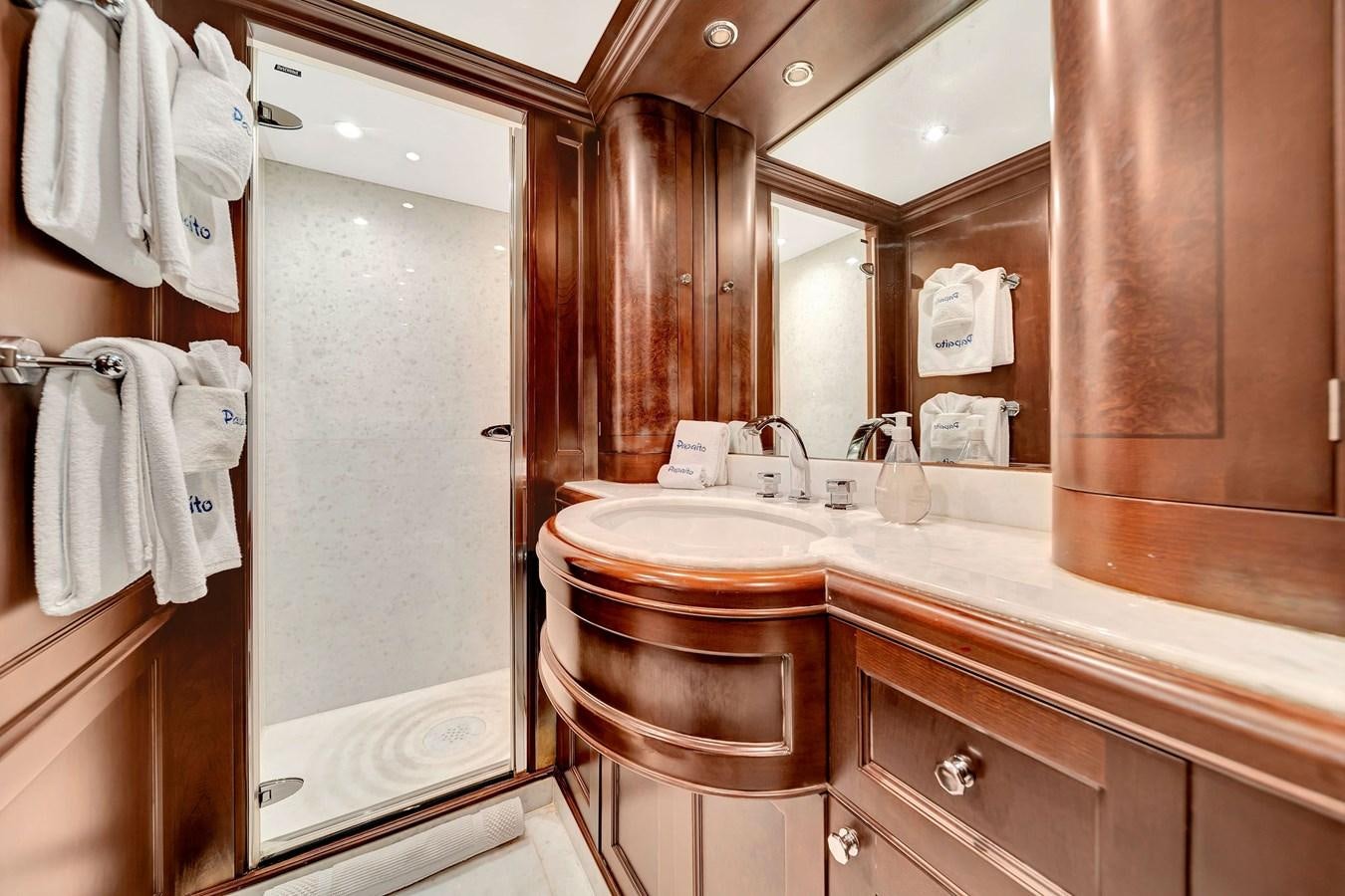 a bathroom with a sink and a mirror aboard PAPAITO Yacht for Sale