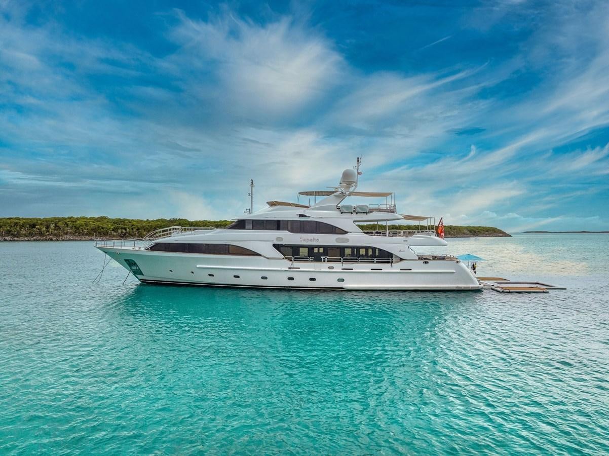 a large white boat in the water aboard PAPAITO Yacht for Sale