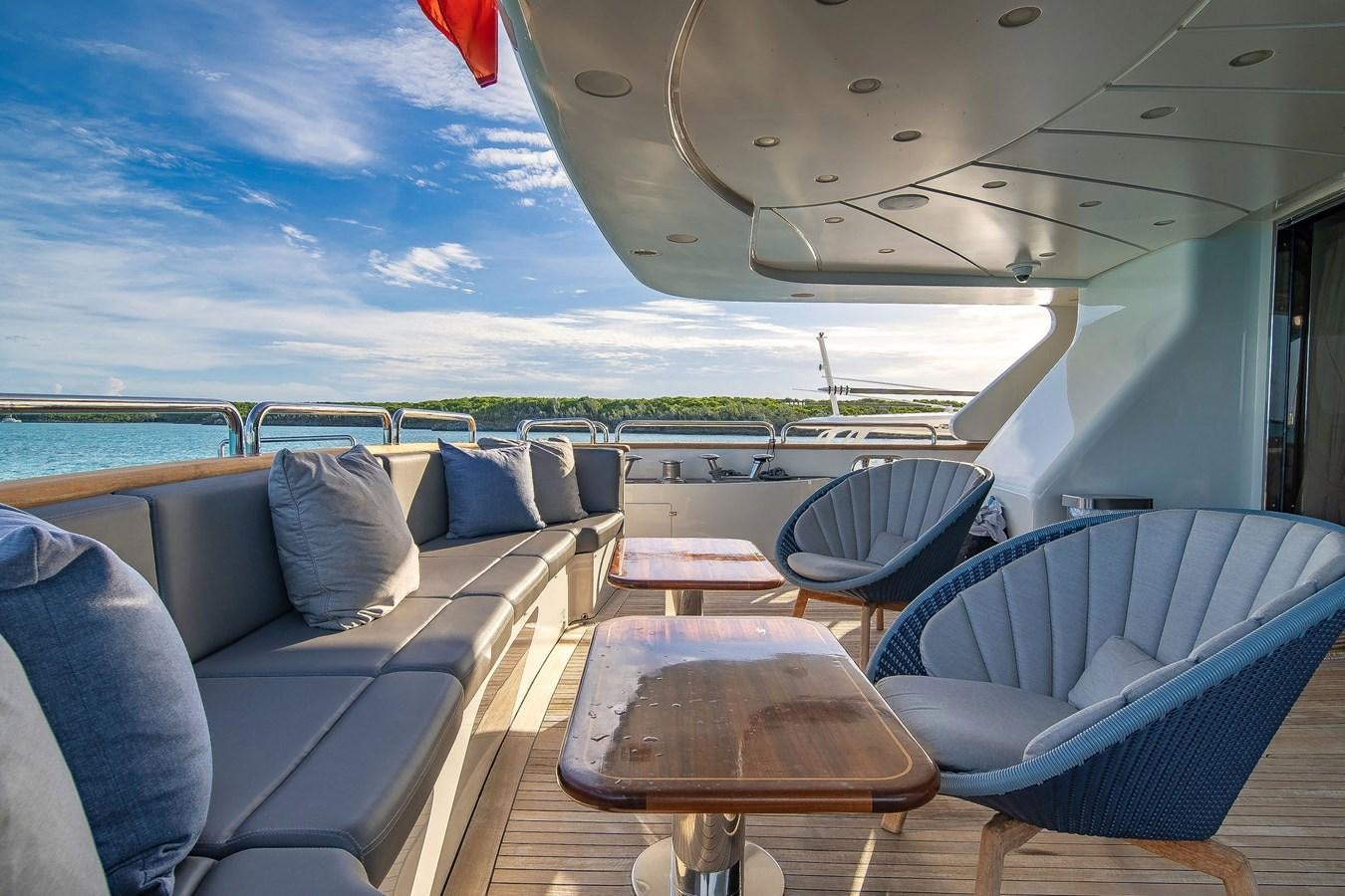 a boat with a deck and chairs aboard PAPAITO Yacht for Sale