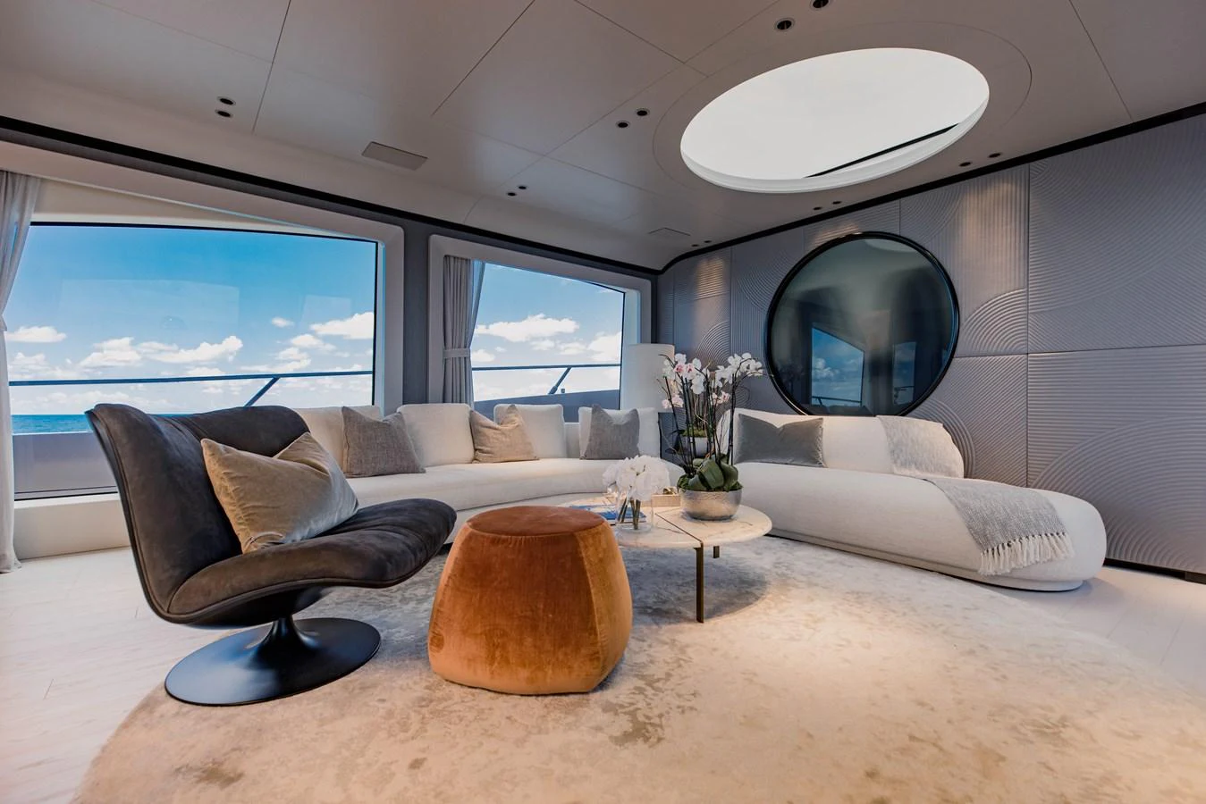 a living room with a large mirror aboard OFFLINE Yacht for Sale