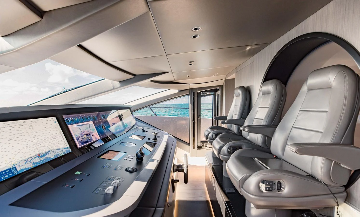 inside of a vehicle with a large screen and a large window aboard OFFLINE Yacht for Sale
