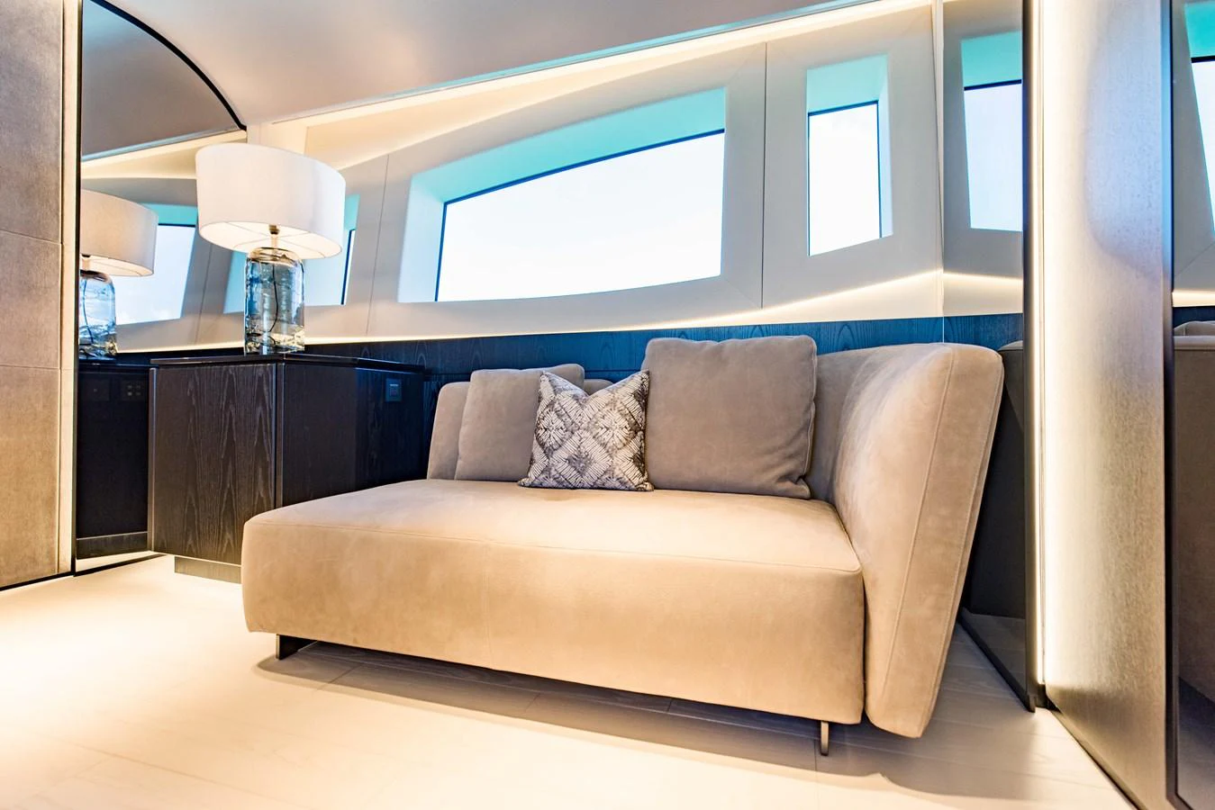 a couch in a room aboard OFFLINE Yacht for Sale