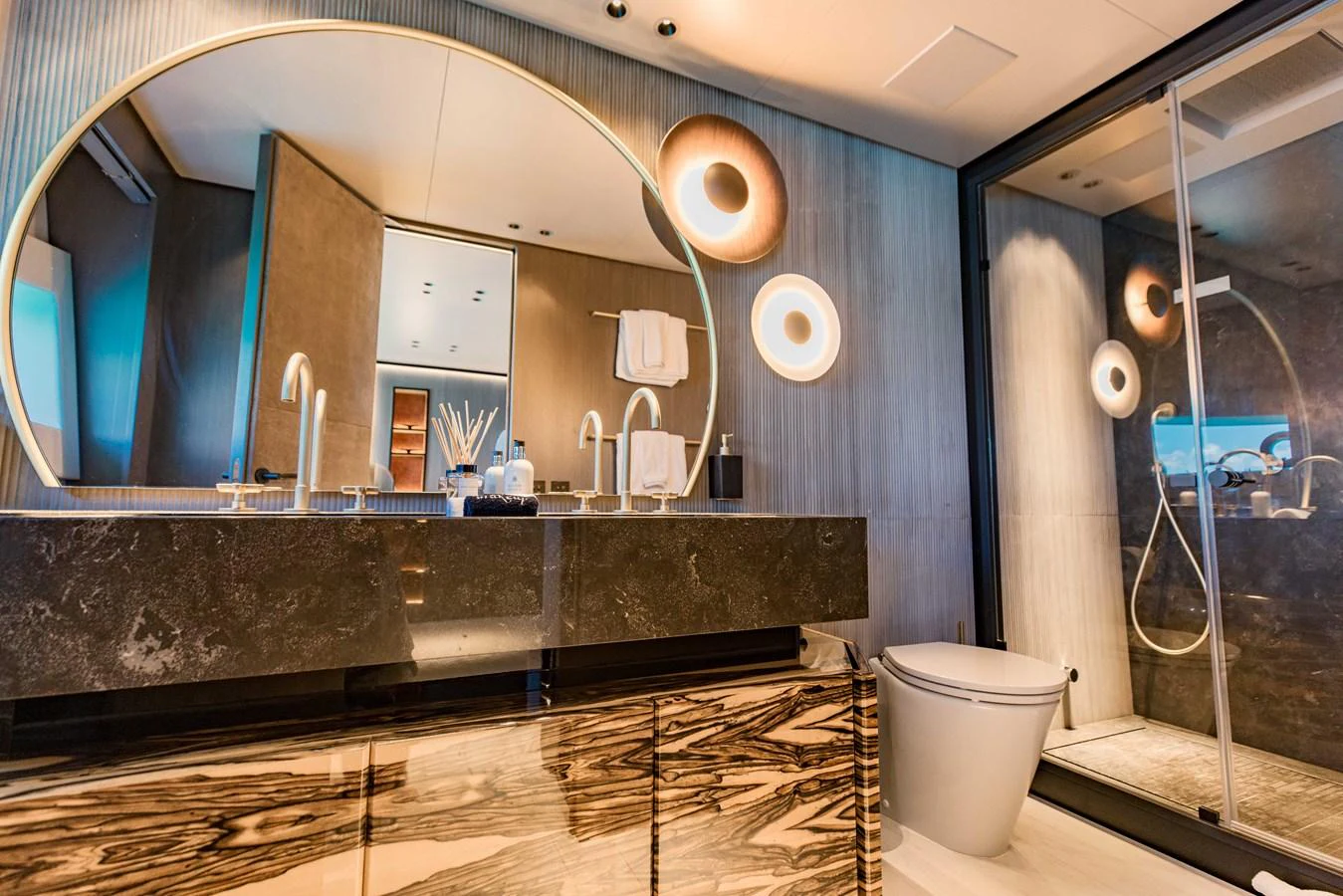 a bathroom with a large mirror aboard OFFLINE Yacht for Sale