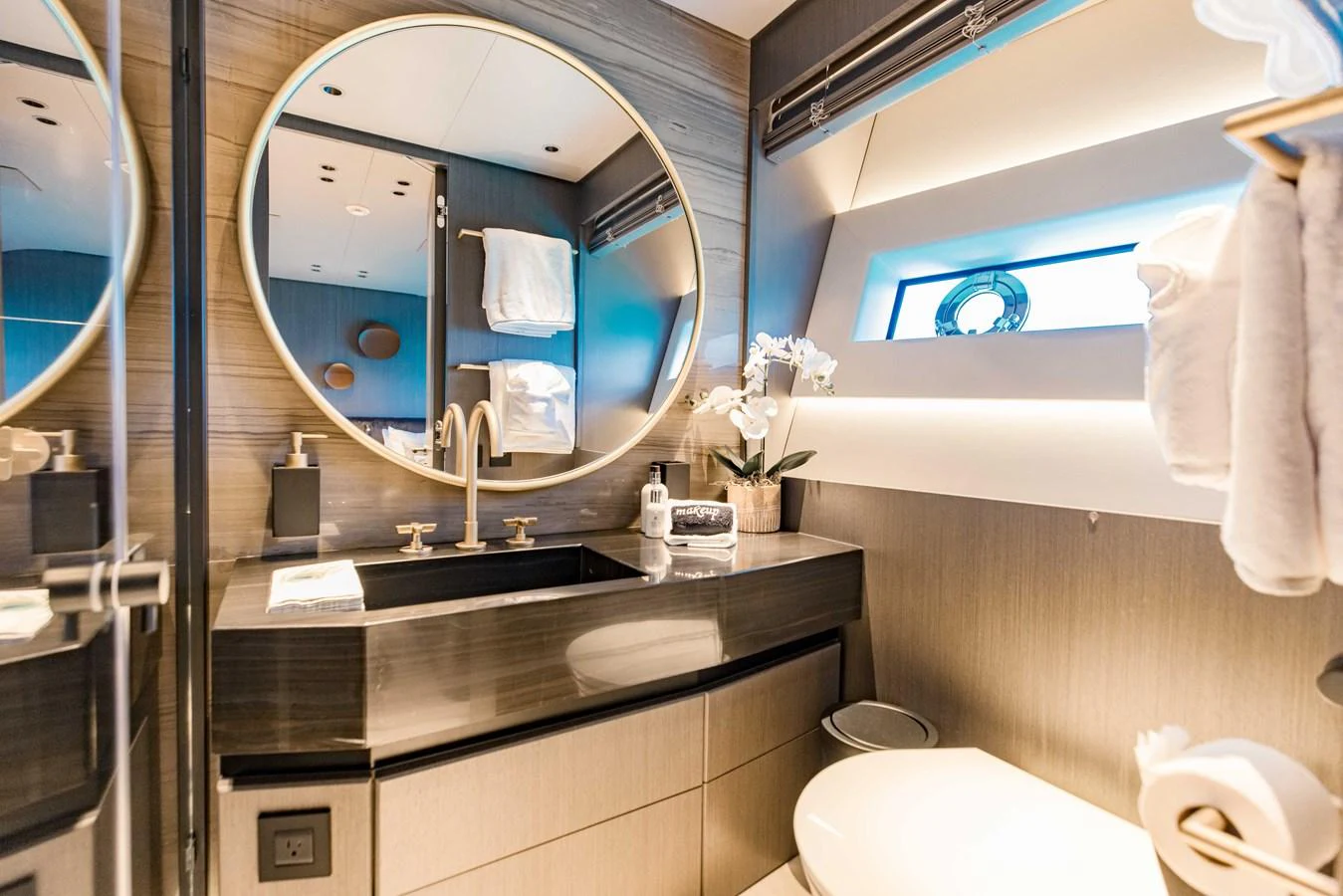 a bathroom with a large mirror aboard OFFLINE Yacht for Sale