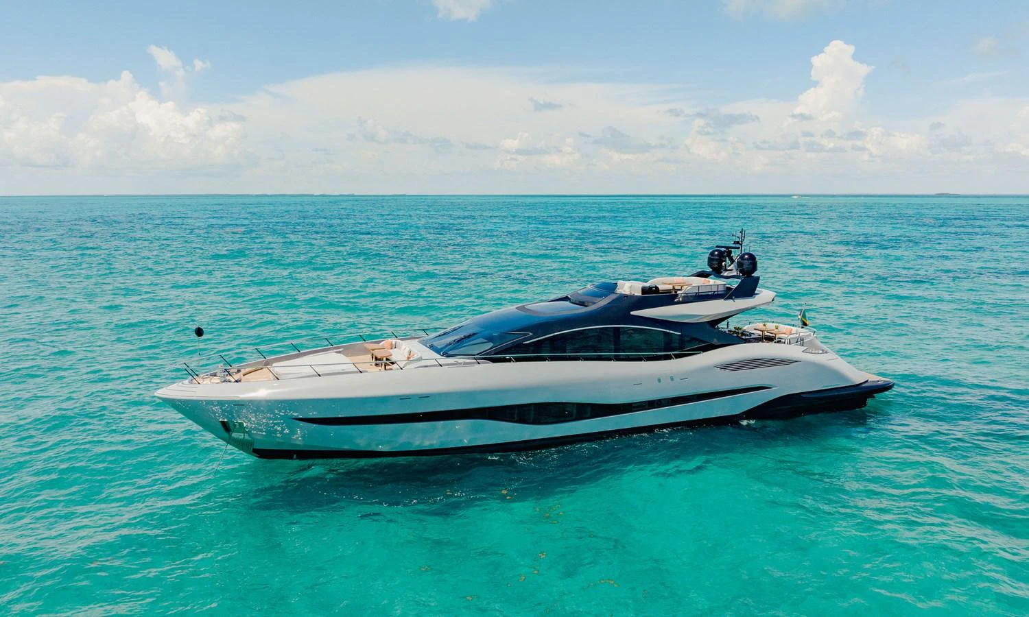 a white boat in the water aboard OFFLINE Yacht for Sale