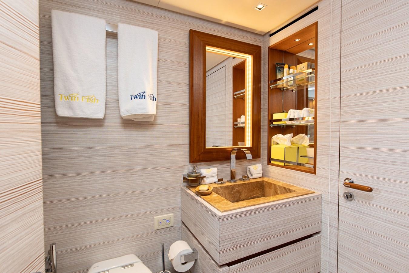 a bathroom with a sink and a mirror aboard THE GREAT ESCAPE Yacht for Sale