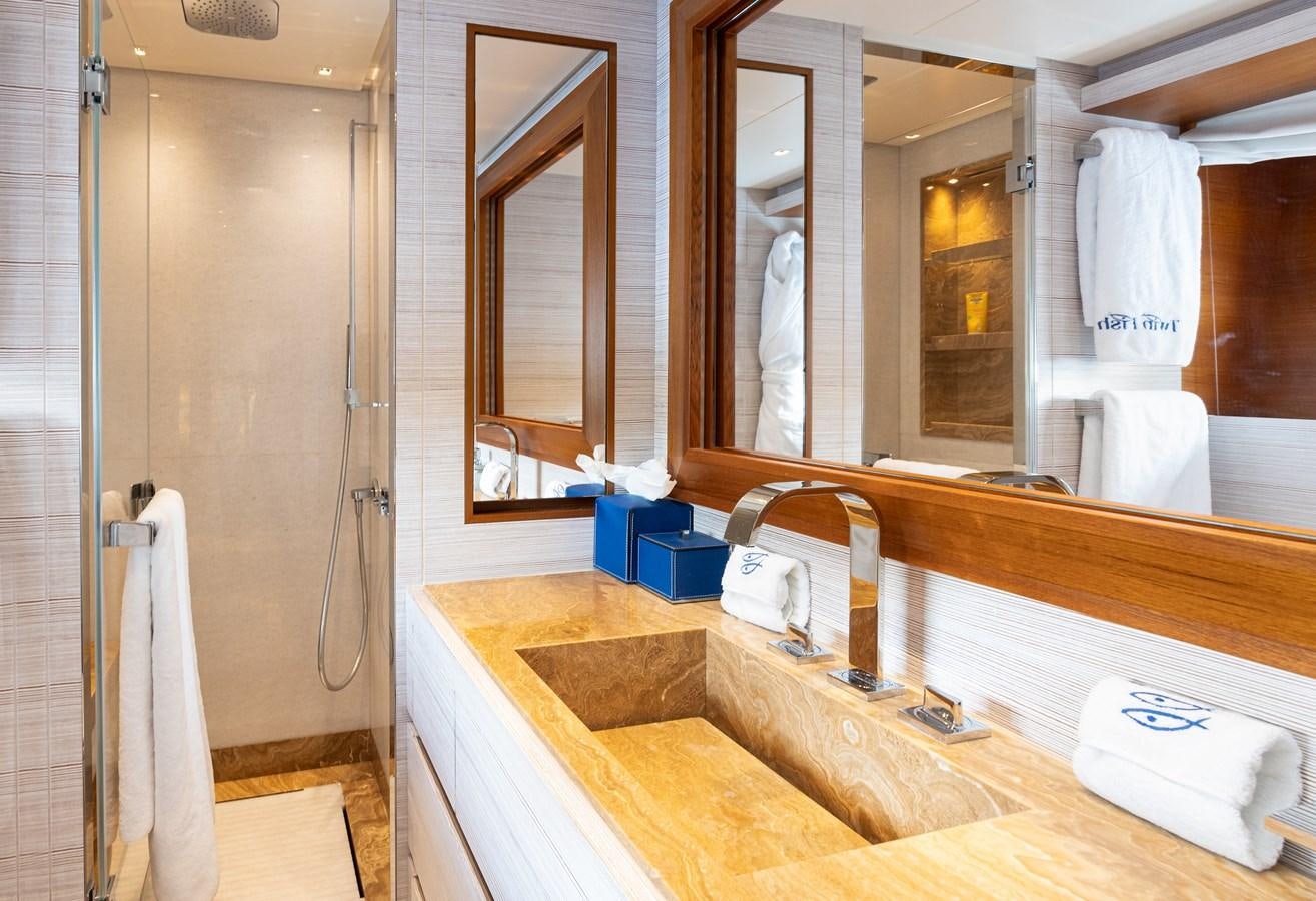 a bathroom with a sink and a mirror aboard THE GREAT ESCAPE Yacht for Sale