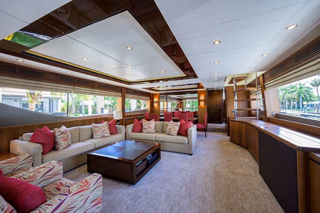 a living room with a large window aboard FREUDIAN SLIP Yacht for Sale